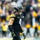 Iowa defensive back Dane Belton (4) reacts after a stop during a NCAA Big Ten Conference football game against Minnesota, Saturday, Nov. 13, 2021, at Kinnick Stadium in Iowa City, Iowa.